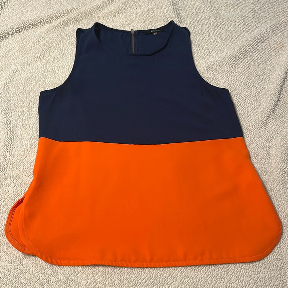 Navy and Orange top.